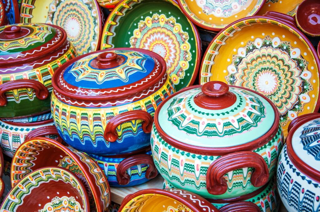 Colorful ceramic cooking pots. Traditional bugarian patterns